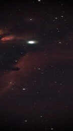 Horsehead Nebula astrophotography print showing dark horse-shaped dust cloud against glowing red hydrogen gas in Orion’s Belt – astronomy wall art.