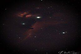 Horsehead Nebula astrophotography print showing dark horse-shaped dust cloud against glowing red hydrogen gas in Orion’s Belt – astronomy wall art.