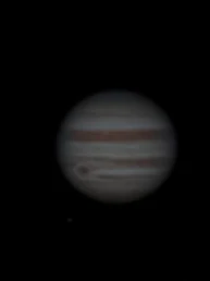 Jupiter astrophotography showing the planet’s coloured cloud bands and the Great Red Spot against the dark sky.
