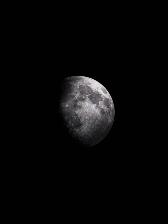 High resolution Moon astrophotography showing craters and surface detail during a waxing gibbous lunar phase against a dark sky.